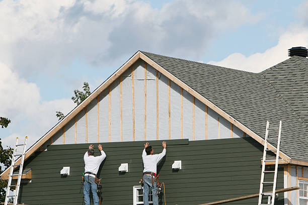 Professional Siding technician working in Carle Place, NY